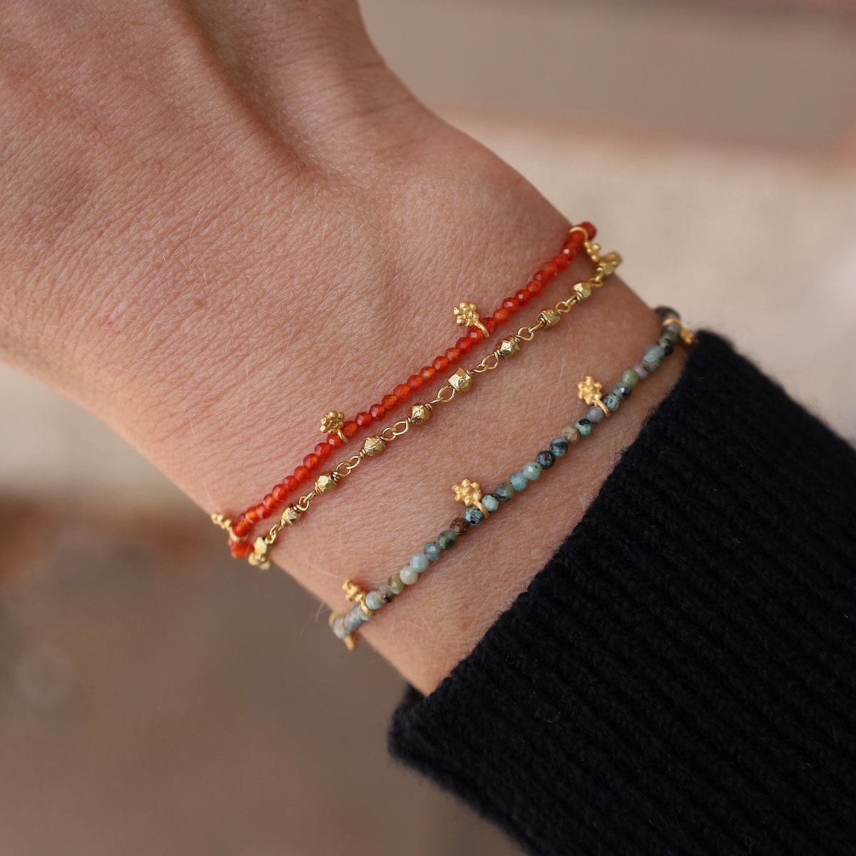 BRC-GPL Faceted Red Onyx with Gold Charms Bracelet
