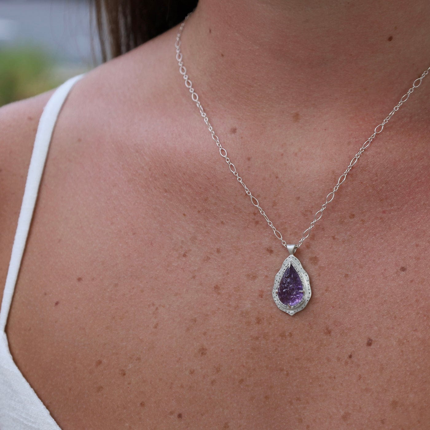 NKL One of a Kind Claw Set Floral Carved Amethyst Necklace